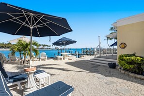 Terrace/patio - Waterfront beauty with a dock, small private beach, washer/dryer, & gas grill (Key Colony Beach)