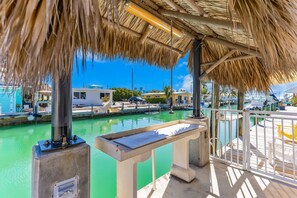 Property grounds - Custom canal-front home with private pool, palapa hut, & outdoor kitchen (Marathon)