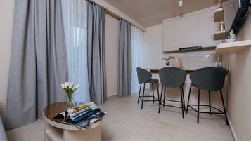 Standard Apartment, Balcony, Sea View | Living area | Flat-screen TV