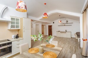 Deluxe Apartment, Balcony, Partial Sea View | Private kitchen | Stovetop, electric kettle, cookware/dishes/utensils