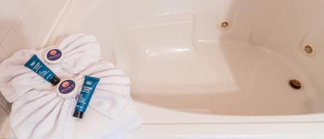 Jetted bath, hair dryer, towels, soap