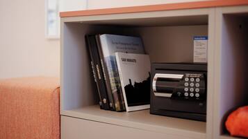 A shelf with books and a printer.