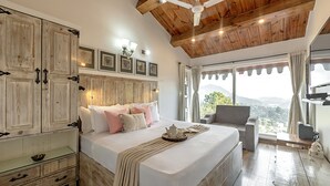 A bedroom with a wooden ceiling, a bed with pillows, a bedside table, and a view of the outdoors. - Alaya Stays Farsauli 1 Pet friendly 3BHK (Nagri Gaon)