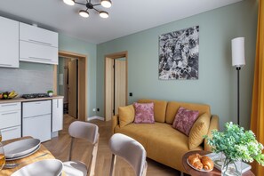 Superior Apartment, City View | Living area | 40-inch TV with cable channels - Apart in the historical center of Minsk (Minsk)
