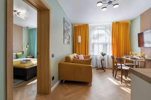 Superior Apartment, City View | Living area | 40-inch TV with cable channels - Apart in the historical center of Minsk (Minsk)
