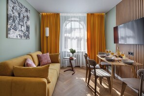 Superior Apartment, City View | Living area | 40-inch TV with cable channels - Apart in the historical center of Minsk (Minsk)