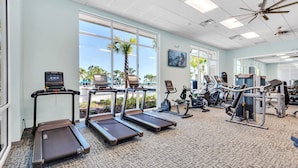 A gym with treadmills, stationary bikes, and weight machines. - Upstay Disney Family Adventure With Pool Hot Tub (Davenport)