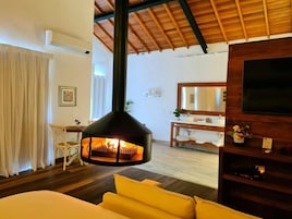 Superior Bungalow, Balcony, Garden View | Living area | Fireplace