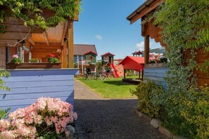 Property grounds - Two-story holiday homes with a pool (Rewal)