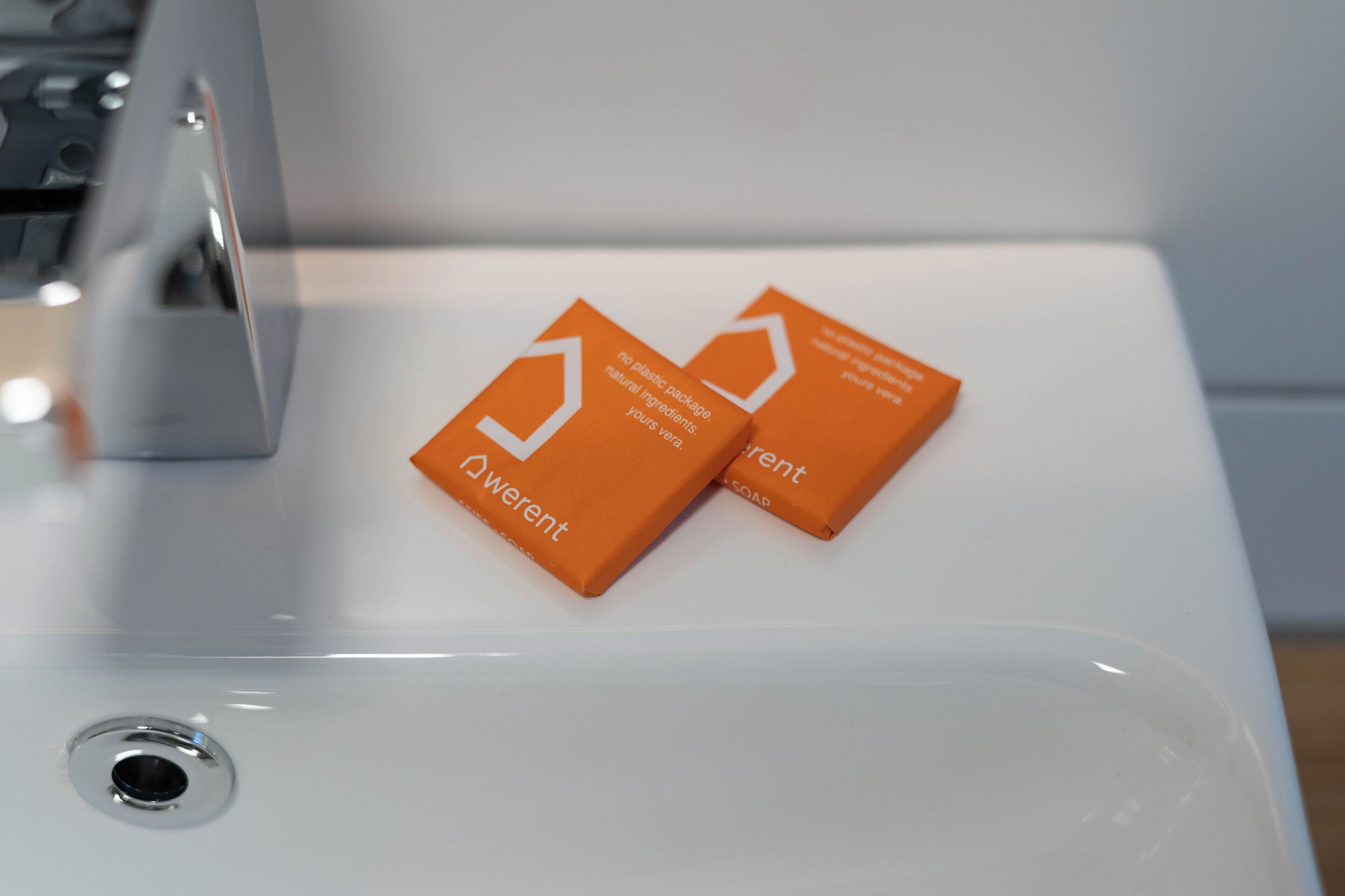 Two orange boxes with white text on a white surface.