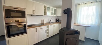 Vacation apartment with open kitchen in spacious house with courtyard and garden