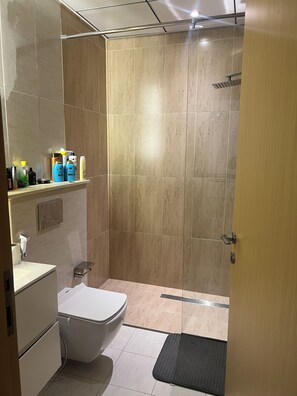 Shower, towels, toilet paper - Cozy 1-bedroom apartment with AC in fabulous Jumeriah Village Circle (Jumeriah Village Circle)