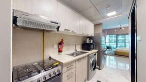 Fridge, microwave, oven, stovetop - Cozy Modern Studio l Quiet Community l Dubai South (Dubai South)