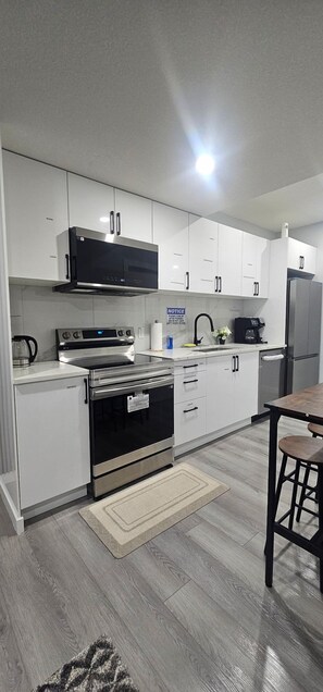 Fridge, microwave, oven, stovetop - Serene Modern Suite | 2BR, Trail & Nearby Lake (Spruce Grove)