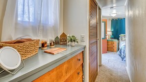 A bathroom with a shower, a mirror, and a towel rack. - 2 Mi to Midtown! All-season Base w/ Hot Tub Access (Ruidoso)