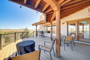 A wooden deck with outdoor furniture, a barbecue, and a view of the landscape. - Golfer's Haven! Mtn-view Dewey Gem w/ Pool Access (Dewey)