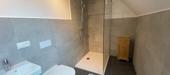 Vacation apartment on the top floor in a spacious house with courtyard and garden
