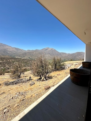 A balcony with a view of a mountainous landscape. - Gorgeous 3-bedroom farmhouse in charming San Esteban awaits you (San Esteban)