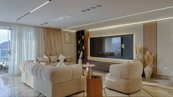 Apartamento ejecutivo, 4 habitaciones, Aire acondicionado, vistas al río | Zona de estar