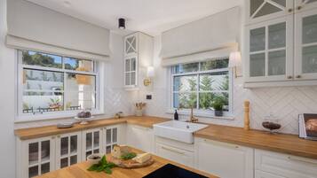 Villa | Private kitchen | Coffee/tea maker, fridge, oven, dishwasher