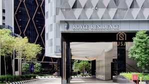 A modern building with a geometric facade and the name 'ROYCE RESIDENCE' prominently displayed. - Royce Residences KLCC by CREMES KL (Kuala Lumpur)