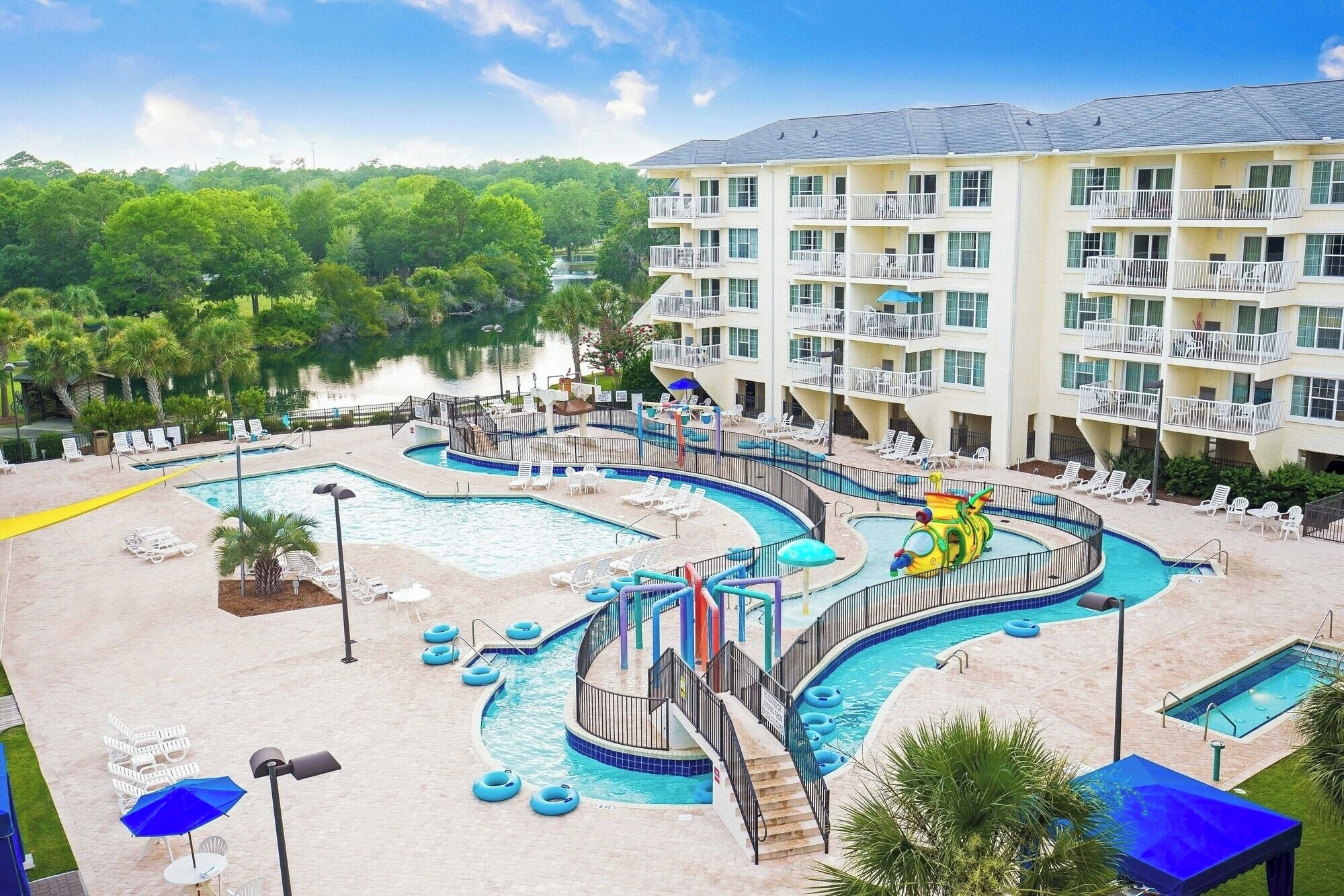 Soak up sunshine with a sweeping view of the resort pools