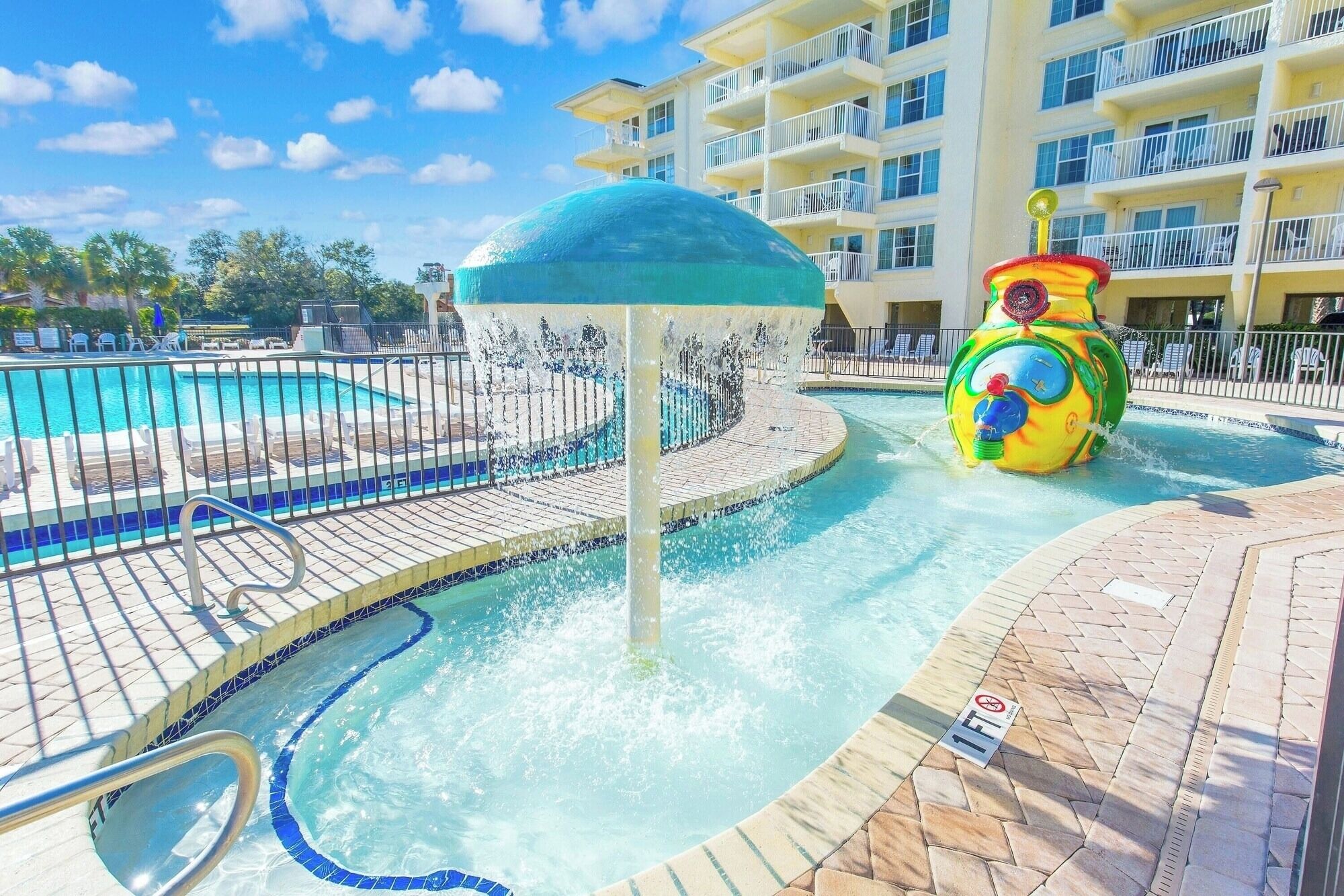 Splash and giggle beneath the mushroom fountain and lazy waterway