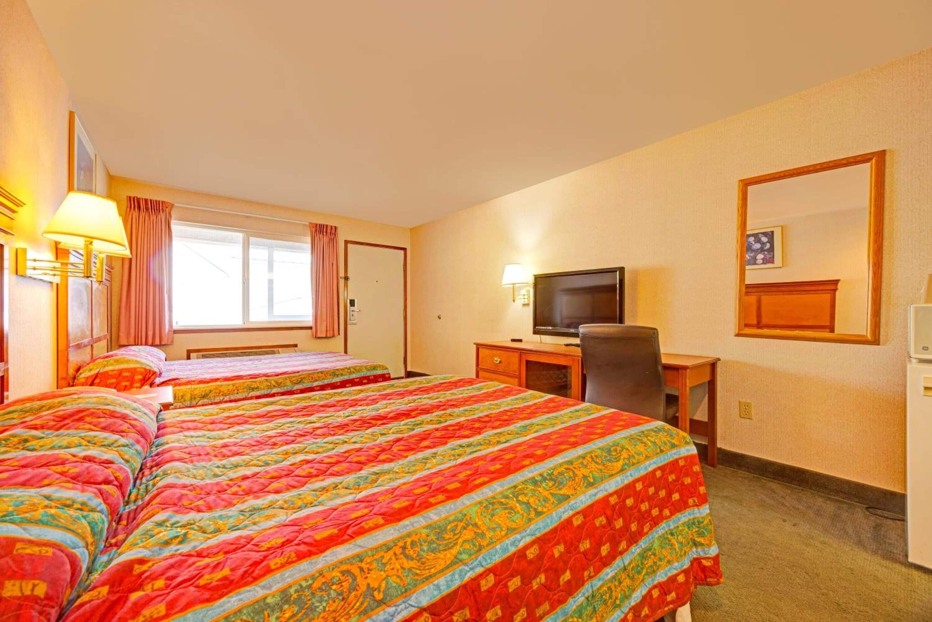 Settle in with comfy beds, TV entertainment, and a work desk.