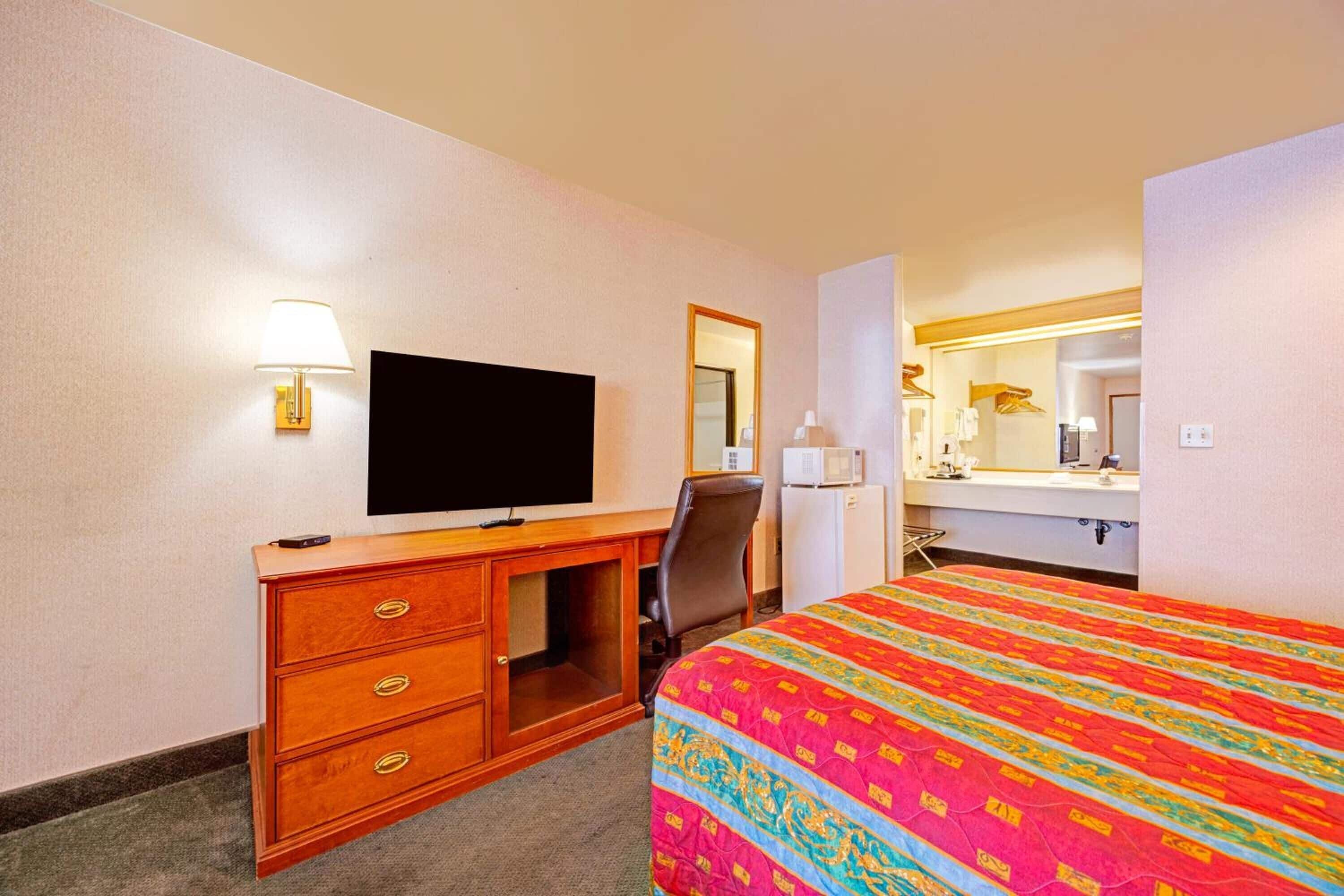 Kick back with your favorite shows and a convenient workspace.