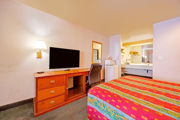 Kick back with your favorite shows and a convenient workspace.