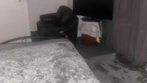 A bedroom with a bed, a television, and a small table. - Room-cozy Private Room With Modern Ameni (Dagenham)