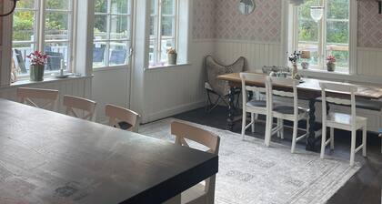 Lake house with its own swimming area, guest cottage, sauna and orangery and boules court.