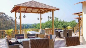 Outdoor dining - Elegant 1BHK Suite in EkJap Paradise Palms – Modern, Cozy Living (Nerul)