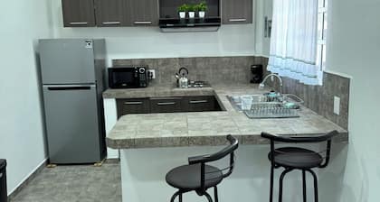 1-br bungalow in amazing San Patricio with AC, Pool, and half a block from beach