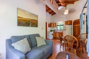 Apartment, 1 Bedroom, Balcony, Pool View | Living area