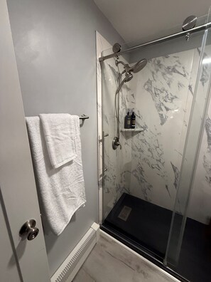 Shower, hair dryer, towels, soap