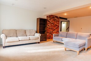 Smart TV, fireplace, foosball, books
