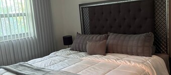 Modern Cozy Retreat • 1BR Comfort • 5min to Beach. Free Wifi, Parking & Pool.