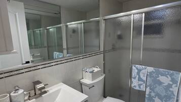 Shower, hair dryer, towels, soap