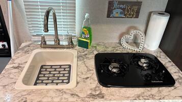 Fridge, microwave, stovetop, cookware/dishes/utensils