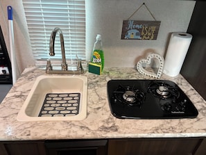 Fridge, microwave, stovetop, cookware/dishes/utensils