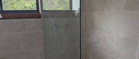 Shower, towels, soap, toilet paper