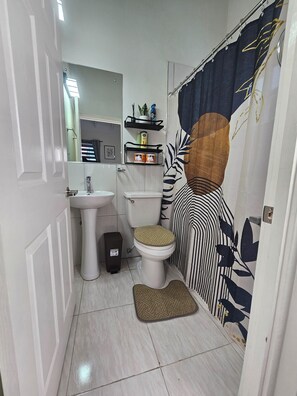 Shower, hair dryer, towels, soap - 2-bedroom brand new central townhome in soothing Portmore with air conditioning (Portmore)