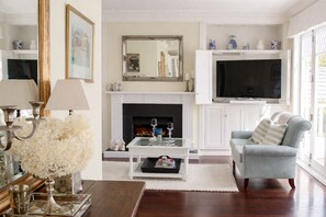 Smart TV, fireplace, books