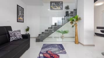 Apartment (De Luxe Three Bedroom Apartment with ) | Living room | 32-inch flat-screen TV with satellite channels