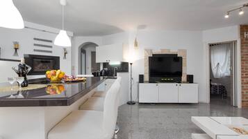 Apartment (Superior Two Bedroom Apartment with T) | Living room | 32-inch flat-screen TV with satellite channels
