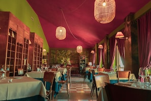 A restaurant with tables set for dining, a checkered floor, and hanging wicker lamps. - Elite Residence Near Rome and Tivoli (Roma)