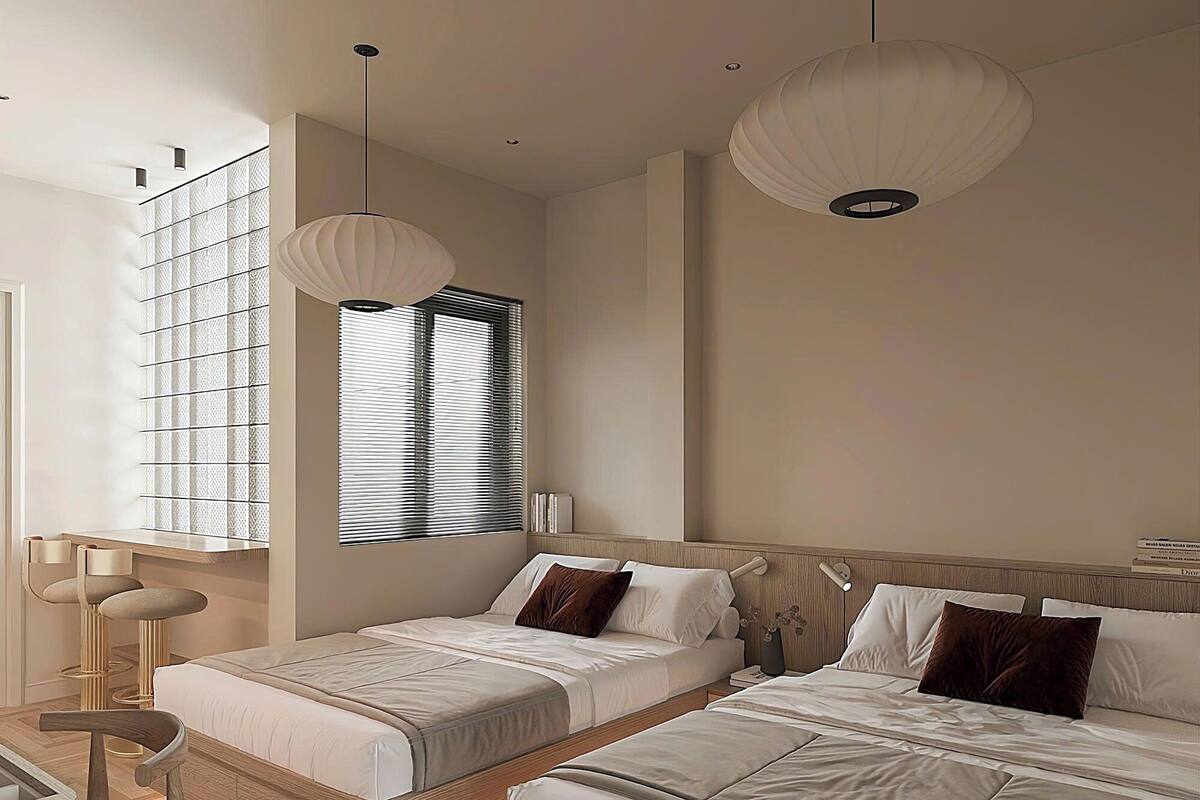 A modern bedroom with two beds, a desk, and a large window with blinds.