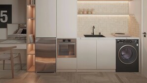 A compact kitchen with built-in appliances, a sink, and a dishwasher. - Co Giang Premier Residence (Ho Chi Minh City)