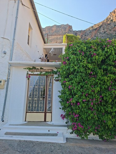 At the foot of the red cliff.